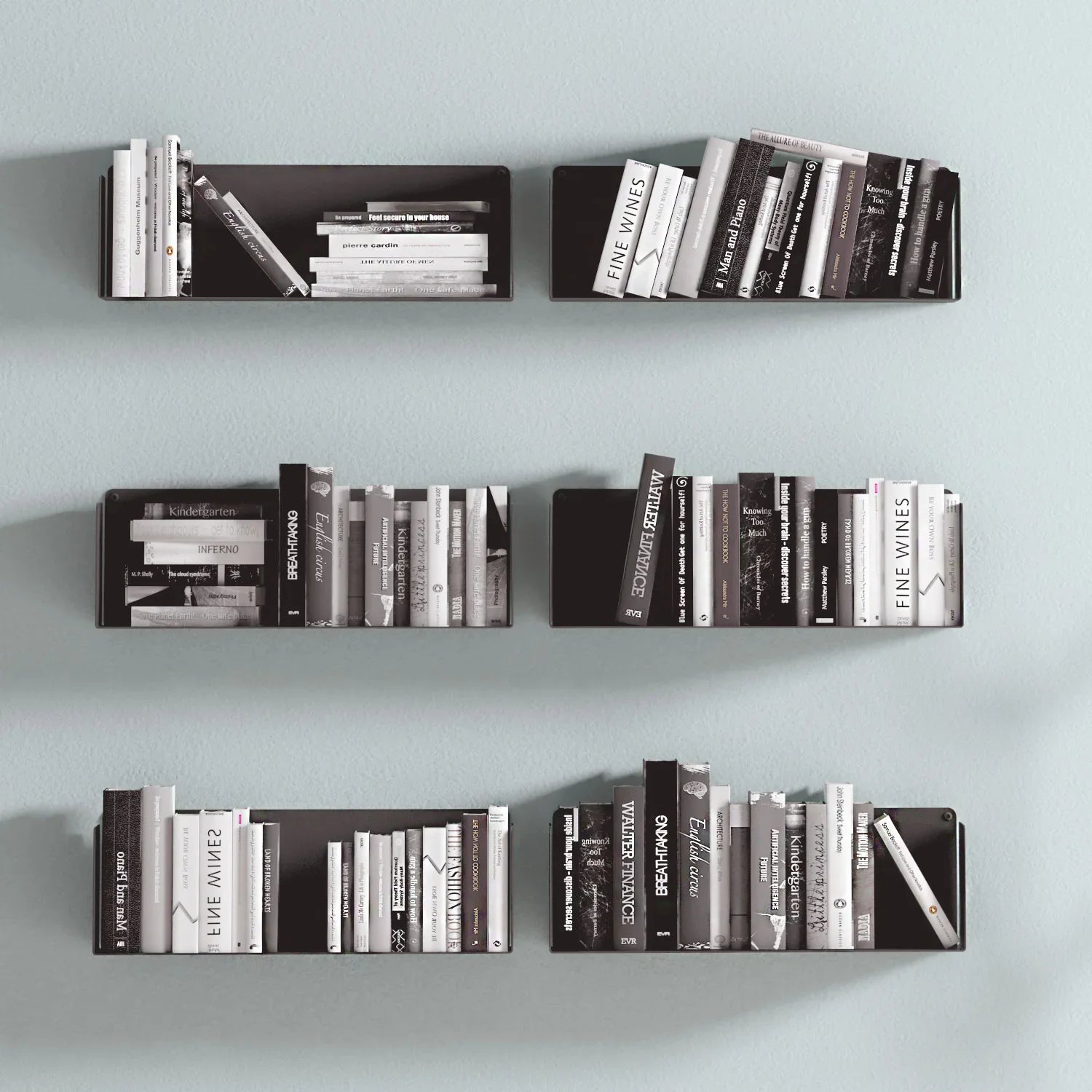 Estantes flotantes negros de metal con libros en la pared