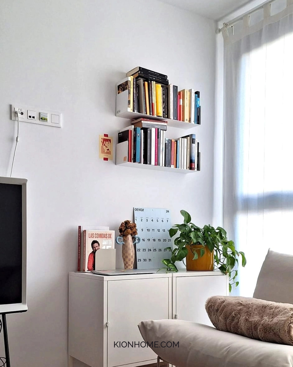 white wall-mounted floating shelves with books in living room, modern shelves for small spaces
