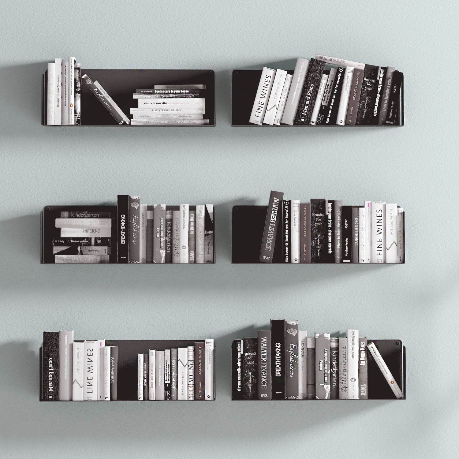 Estantes flotantes negros de metal con libros en la pared