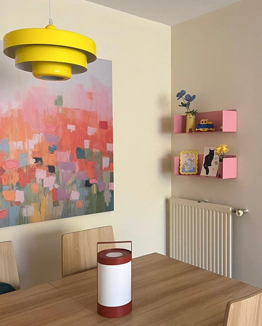 Pale pink metal floating shelves, modern colorful design on living and dining room walls with decor